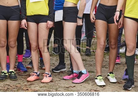 Young Female Atheletes Ready To Run. Race Start Line. Athleticism
