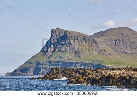 Faroe Islands Dramatic Coastline Landscape In Vagar Island. Seascape