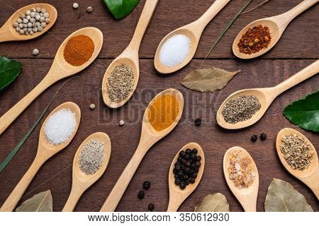 Various Spices In Wooden Spoon On Wood Table Background, Sugar, Pepper, Salt, Turmeric, Rosemary, Or