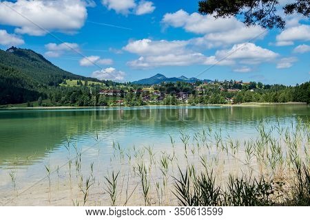 Weissensee Lake In The Bavarian Alps Near Fuessen, Allgaeu, Bavaria, Germany