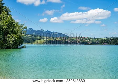 Weissensee Lake In The Bavarian Alps Near Fuessen, Allgaeu, Bavaria, Germany
