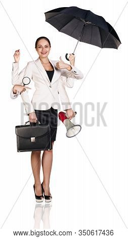 Young Business Woman Multitasking With Different Staff In Hands. Isolated On White Background.