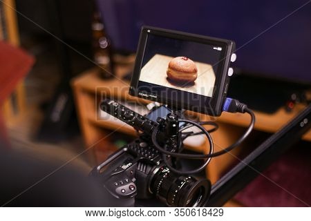 Zefat, Israel - Nov. 27, 2019: Filming Hanukkah Food Doughnuts With Blackmagic Design Pocket Cinema 