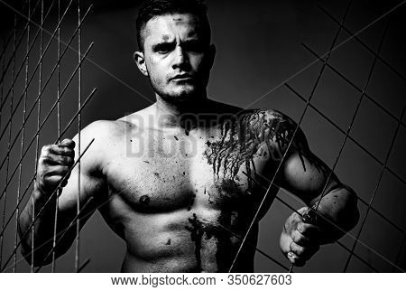 Scary Monster Just Murdered His Victim. Strong Aggressive Monster Behind Grid. Prison For Monster. P