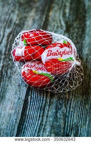 Istanbul, Turkey - February 23, 2018: Mini Babybel Cheese In Red Wax On Wooden Surface.