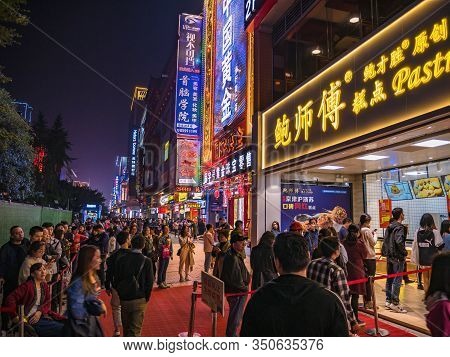 Changsha/china-17 October 2018:unacquainted People Walking On Huangxing Walking Street In Changsha C