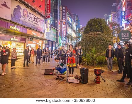Changsha/china-17 October 2018:unacquainted Street Performers Singing And Wearing Traditional Tribe 