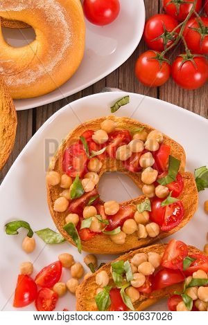 Friselle With Tomatoes And Chickpeas On White Dish.