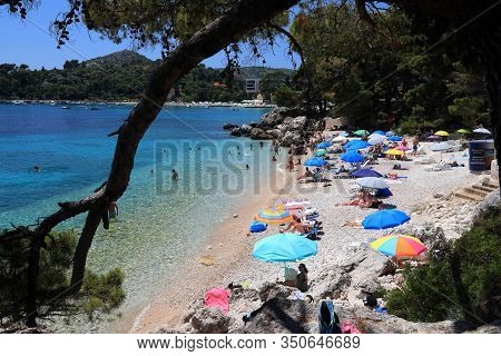 Mlini, Croatia - June 27, 2019: Tourists Enjoy Summer Vacation In Mlini Near Dubrovnik. Croatia Had 