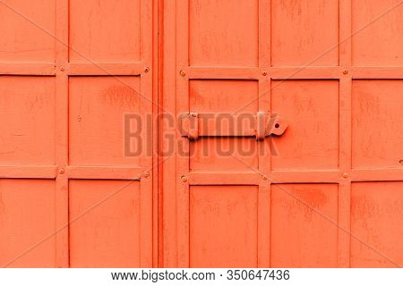 Antique Pink Metal Gate With A Deadbolt