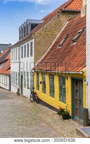 Haderslev, Denmark - June 26, 2019: Colorful Yellow House In The Historic Streets Of Haderslev, Denm