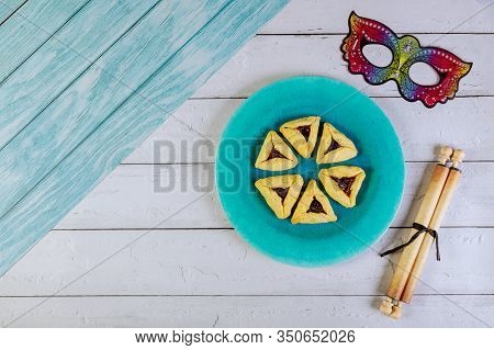 Jewish Cookies Haman Ears With Jam For Purim With Tora Papyrus Roll And Mask.
