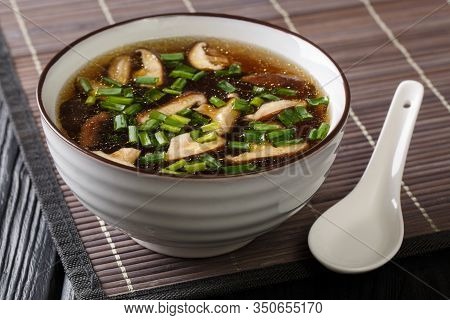 Asian Soup With Shiitake Mushrooms, Green Onions Close-up In A Bowl. Horizontal