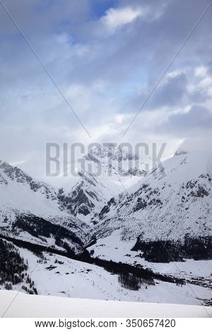 Snowy Ski Slope In High Mountains And Cloudy Sunlit Sky At Winter Evening. Ski Area Mottolino Fun Mo