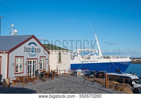 Hornafjordur Iceland - July 1. 2019: Pelagic Trawler And Historic Building Behind Restaurant Ishusid