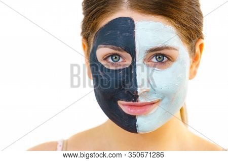 Girl With Black White Mud Mask On Face