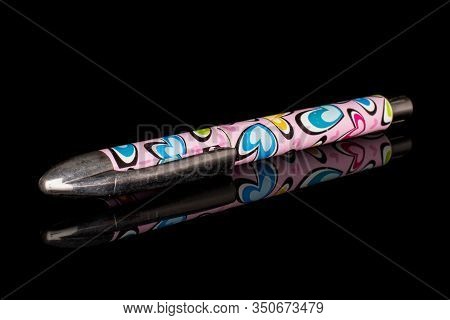 One Whole Writing Ballpoint Pen Isolated On Black Glass