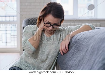 Sad Depressed Age Lonely Woman Sitting On Floor. Depression, Melancholy, Problems With Barometric Pr