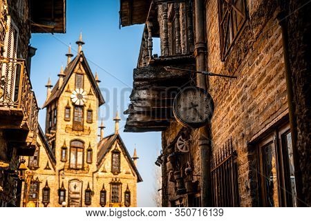 Gonzalez Catan, Argentina, September 28, 2019: Very Old Watch Hanging From A Brick Wall Of Abandoned