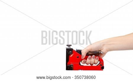 Red Industrial Stapler, Furniture Industry Hardware. Isolated On White.