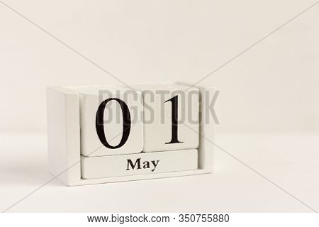 May 1 On The Wooden Calendar.the First Day Of The Spring Month, A Calendar For The Workplace. Spring