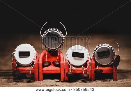 Crown Cork Or Bottle Cap Miniature Figures With 3-d Specs On Red Cinema Chairs, Humorous Conceptual 
