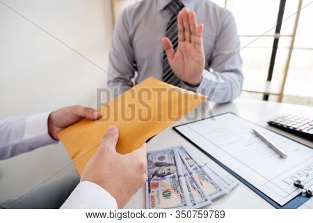 The Businessman Denies The Money In Envelope Proposed By His Partner To Bribe The Concept Of Bribery