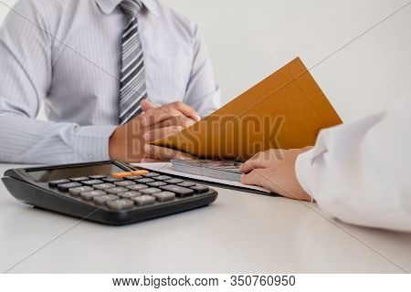 Businessmen Make An Agreement With The Money Proposed His Partner To Bribe In The Company. The Conce