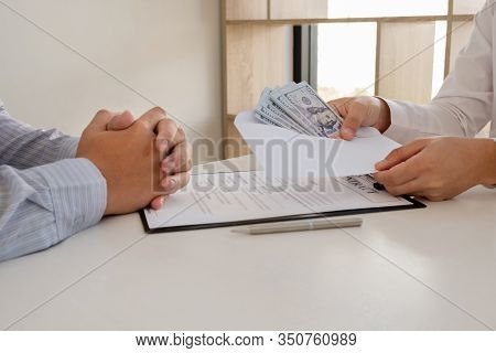 Businessmen Make An Agreement With The Money Proposed His Partner To Bribe In The Company. The Conce