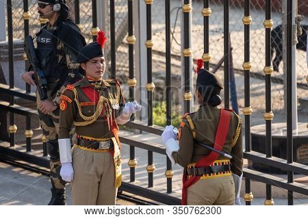 Attari, India - Febuary 8, 2020: Women Members Of The  Indian Border Security Force Members Face Off