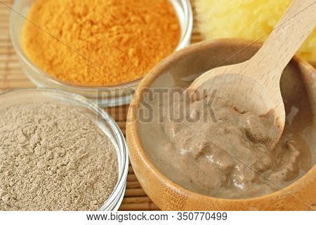 Homemade Rhassoul (ghassoul) And Turmeric Face Mask In Wooden Bowl With Spoon