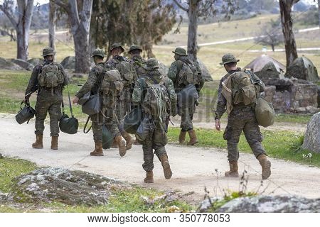 Troop Of Ground Soldiers Walking In The Field