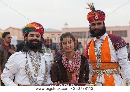 BIKANER, RAJASTHAN, INDIA - JANUARY 11, 2020: Indian warrior riding on camels during Camel festival