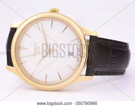 Le Locle, Switzerland 15.01.2020 - Tissot Woman Watch Stainless Steel Case, Gold Pvd Coating White C