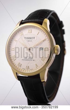 Le Locle, Switzerland 15.01.2020 - Tissot Man Watch Stainless Steel Case, Gold Pvd Coating White Clo