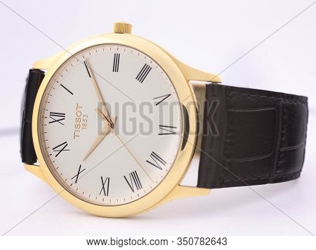 Le Locle, Switzerland 15.01.2020 - Tissot Man Watch Stainless Steel Case, Gold Pvd Coating White Clo
