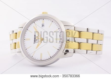 Le Locle, Switzerland 15.01.2020 - Tissot Woman Watch Stainless Steel Case, Gold Pvd Coating White C