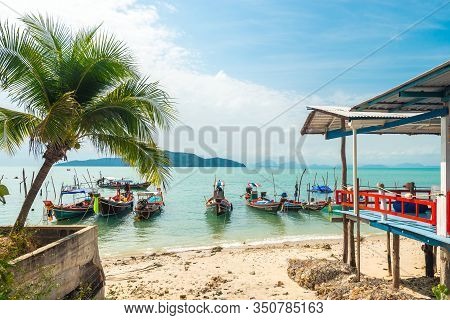 Koh Samui, Thailand - January 2, 2020: Authentic Thai Fishing Boats Docked At Thong Krut Beach In Ta
