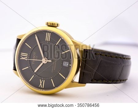 Le Locle, Switzerland 15.01.2020 - Tissot Woman Watch Stainless Steel Case, Gold Pvd Coating Black C