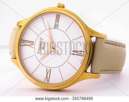 Le Locle, Switzerland 15.01.2020 - Tissot Woman Watch Stainless Steel Case, Gold Pvd Coating White C