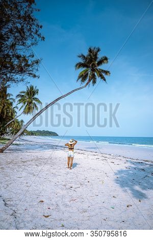 Wua Laen Beach Chumphon Area Thailand, Palm Tree Hanging Over The Beach With Girl On Vacation In Tha
