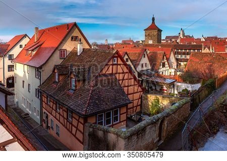 Aerial View From Town Wall Of Weisser Turm And Quaint Colorful Facades And Roofs Of Medieval Old Tow
