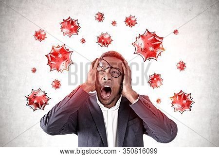 Scared Young African American Man Screaming Standing Near Concrete Wall With Virus Molecules Drawn O
