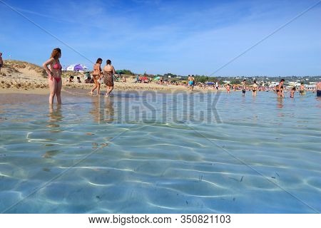 Salento, Italy - June 2, 2017: People Visit Maldives Di Pescoluse Beach In Salento Peninsula, Italy.