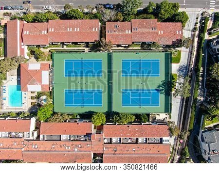Aerial View Of Typical South California Community Condo With Tennis Court And Pool Next To The Sea O