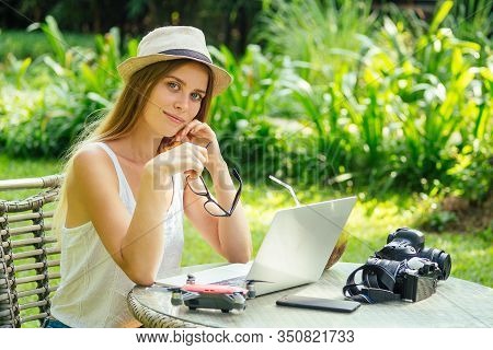 Young Photographer Woman Feeling Happy Becouse She Get Money Online While Sitting At Tropical Cafe