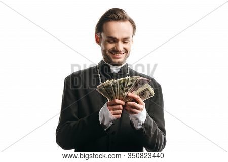 Corrupt Catholic Priest Smiling While Holding Dollar Banknotes Isolated On White