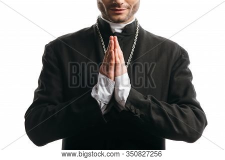 Cropped View Of Catholic Priest In Black Cassock Praying Isolated On White