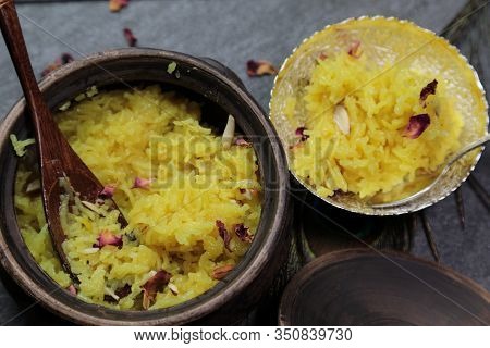 Sweet Rice Or Zarda Pulao On A Grey Background With Copy Space.