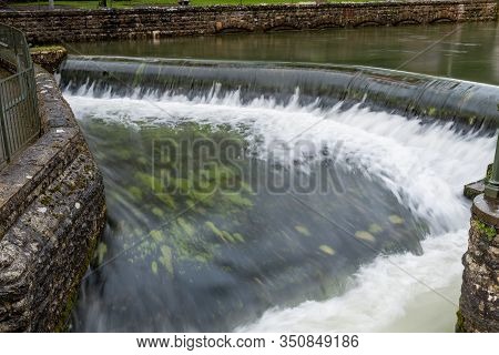 Long Exposure Of A Waterfall In Cheddar Village In Somerset